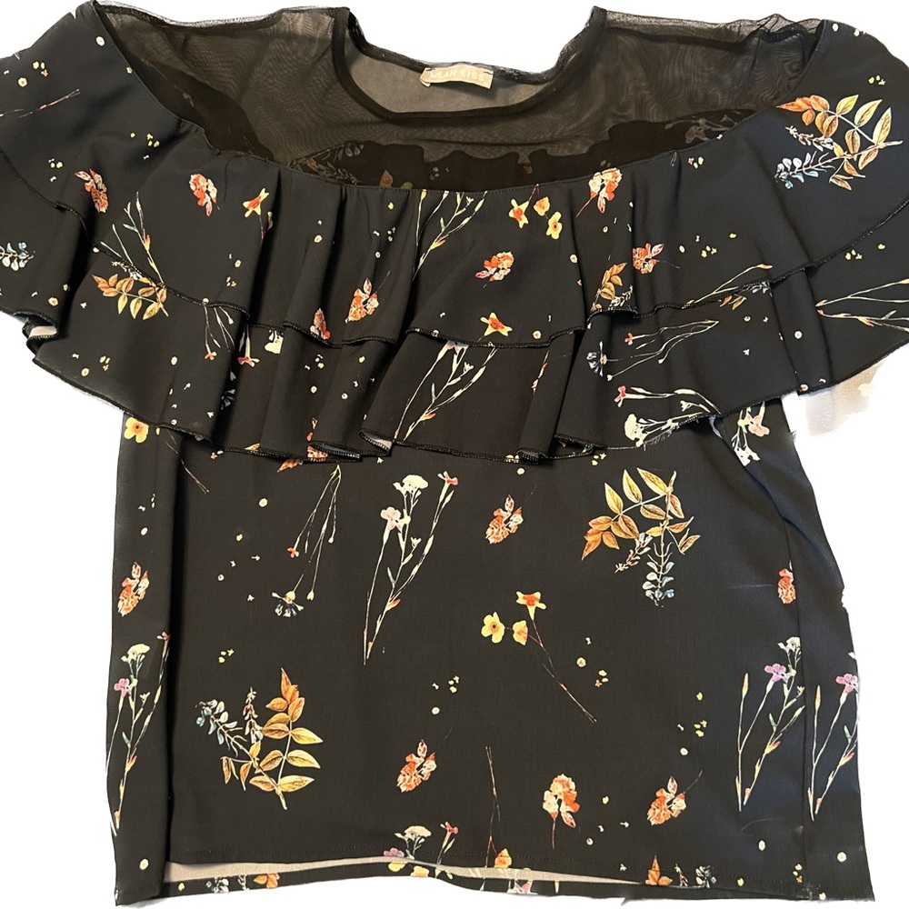 Blouse with sheer neckline